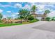 Beautiful community entrance with lush landscaping and a stone fountain adds a touch of elegance at 2632 Tarragona Way, Wesley Chapel, FL 33543