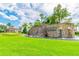 An attractive stone community entrance with a water feature and well maintained landscaping welcomes you home at 2632 Tarragona Way, Wesley Chapel, FL 33543