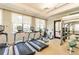 State-of-the-art gym featuring treadmills and weights offers a convenient way to stay active at 2632 Tarragona Way, Wesley Chapel, FL 33543