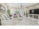 Comfortable living room with tile flooring, neutral colors, modern furniture, and stylish decor at 2632 Tarragona Way, Wesley Chapel, FL 33543