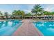 Enjoy the community swimming pool, featuring a sundeck, cabanas, and lounge chairs at 2632 Tarragona Way, Wesley Chapel, FL 33543