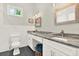 Elegant bathroom boasts double sinks, granite countertops, and ample cabinet space at 2818 N 19Th St, Tampa, FL 33605
