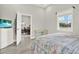 Comfortable bedroom shows desk, dresser, and view to dining room through doorway at 2818 N 19Th St, Tampa, FL 33605