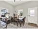 Dining room features a wooden table, natural light, and access to the backyard at 2818 N 19Th St, Tampa, FL 33605