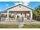 Charming single-story home with a cozy front porch and decorative wrought iron fence at 2818 N 19Th St, Tampa, FL 33605