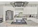 Spacious kitchen features stainless steel appliances and a large island with cooktop at 2818 N 19Th St, Tampa, FL 33605