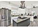 Bright kitchen with stainless steel appliances, custom island, and open floor plan at 2818 N 19Th St, Tampa, FL 33605