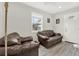 Cozy living room with leather seating, bright natural light, and neutral tones at 2818 N 19Th St, Tampa, FL 33605