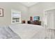 Comfortable main bedroom with a dresser, soft lighting, and a window view at 2818 N 19Th St, Tampa, FL 33605
