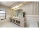 Bathroom features a double sink vanity and large mirror at 2932 Sweetgum S Way, Clearwater, FL 33761