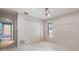 This bedroom includes a closet and is bathed in natural light from a window at 2932 Sweetgum S Way, Clearwater, FL 33761