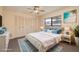 Bedroom with a large window, closet with louvered doors, and stylish decor at 2932 Sweetgum S Way, Clearwater, FL 33761