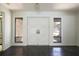 Bright foyer featuring tile flooring, an elegant front door, and sidelight windows at 2932 Sweetgum S Way, Clearwater, FL 33761