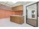 Kitchen area with a breakfast bar, and access to the lanai at 2932 Sweetgum S Way, Clearwater, FL 33761