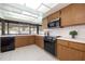 Kitchen with a large window, modern appliances, and sleek countertops at 2932 Sweetgum S Way, Clearwater, FL 33761