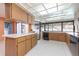 A kitchen featuring sleek countertops, a large window, and modern appliances at 2932 Sweetgum S Way, Clearwater, FL 33761
