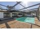 Outdoor pool with screen enclosure and access to the home, perfect for entertaining at 2932 Sweetgum S Way, Clearwater, FL 33761