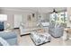Comfortable living area boasts tiled floors and neutral tones, with ample natural light at 2960 59Th S St # 102, Gulfport, FL 33707