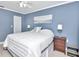Comfortable main bedroom features a ceiling fan and windows with views to the outside at 2960 59Th S St # 102, Gulfport, FL 33707