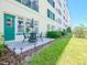 Outdoor patio and dining set located just outside, near green grass at 2960 59Th S St # 102, Gulfport, FL 33707