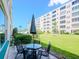 Relaxing patio area with table and chairs, perfect for enjoying the outdoors at 2960 59Th S St # 102, Gulfport, FL 33707