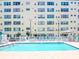 Beautiful community pool with ample seating and well maintained deck at 2960 59Th S St # 102, Gulfport, FL 33707