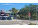 Restaurant street view with palm trees and outdoor dining at 2960 59Th S St # 102, Gulfport, FL 33707