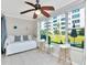 Bright sunroom offers seating, bar stools, and a view of the well-maintained exterior grounds at 2960 59Th S St # 102, Gulfport, FL 33707