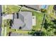 Aerial view of a home featuring a backyard, patio, green lawn, and perimeter fence at 3211 Grassglen Pl, Wesley Chapel, FL 33544