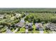 Stunning aerial view of the neighborhood with lush greenery, ponds, and well-maintained homes at 3211 Grassglen Pl, Wesley Chapel, FL 33544