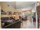 Inviting living room with tile floors, high ceilings, open to the dining area at 3211 Grassglen Pl, Wesley Chapel, FL 33544