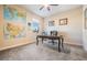 Office space with a wooden desk, leather chair, and a window view at 3211 Grassglen Pl, Wesley Chapel, FL 33544