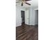 This bedroom features laminate wood flooring, closet, and neutral colors at 3321 Laurel View Dr, Brandon, FL 33511