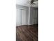 Neutral bedroom with ceiling fan, two closets, and laminate flooring at 3321 Laurel View Dr, Brandon, FL 33511