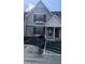 Charming townhouse exterior with gray siding, dark shutters, and convenient parking space at 3321 Laurel View Dr, Brandon, FL 33511