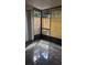 Enclosed sunroom featuring tiled floors and natural light at 3321 Laurel View Dr, Brandon, FL 33511