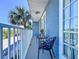 Inviting balcony with seating area, scenic street views, and natural light, perfect for relaxation at 362 Coquina Dr, Tarpon Springs, FL 34689