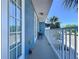 Relaxing balcony with seating area, scenic street views, and natural light, perfect for relaxation at 362 Coquina Dr, Tarpon Springs, FL 34689