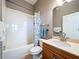 Cozy bathroom features a shower-tub combination with tiled walls, modern fixtures, and a neutral color palette at 362 Coquina Dr, Tarpon Springs, FL 34689