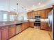Open kitchen with stainless steel appliances, granite counters, and ample cabinet space at 362 Coquina Dr, Tarpon Springs, FL 34689