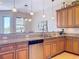 Beautiful kitchen with stainless steel appliances, granite counters, and stylish pendant lighting at 362 Coquina Dr, Tarpon Springs, FL 34689