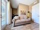 Cozy living room featuring hardwood floors and neutral decor with a comfortable beige couch at 362 Coquina Dr, Tarpon Springs, FL 34689