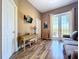 Inviting living room with French doors to the balcony, natural light, and neutral walls at 362 Coquina Dr, Tarpon Springs, FL 34689