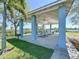 Open-air pavilion featuring picnic tables and a grill, ideal for outdoor gatherings and barbecues at 362 Coquina Dr, Tarpon Springs, FL 34689