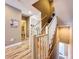 Bright stairway with white wooden railing and wooden steps, offering access to both the upper and lower levels at 362 Coquina Dr, Tarpon Springs, FL 34689