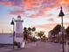 Street view of businesses with sunset sky, light house, and palm trees at 362 Coquina Dr, Tarpon Springs, FL 34689