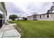 Expansive backyard showcasing green lawn and surrounding landscape at 37539 Landis Ave, Zephyrhills, FL 33541