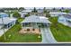 Inviting mobile home featuring a long decorative driveway and well-manicured front yard with rock garden at 37539 Landis Ave, Zephyrhills, FL 33541