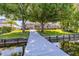 Scenic backyard with lush greenery and a private boat dock, ideal for waterfront living and recreation at 3829 Eagleflight Ln, Land O Lakes, FL 34639