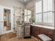 Gorgeous bathroom featuring a tile shower and vanity with granite counters at 3829 Eagleflight Ln, Land O Lakes, FL 34639
